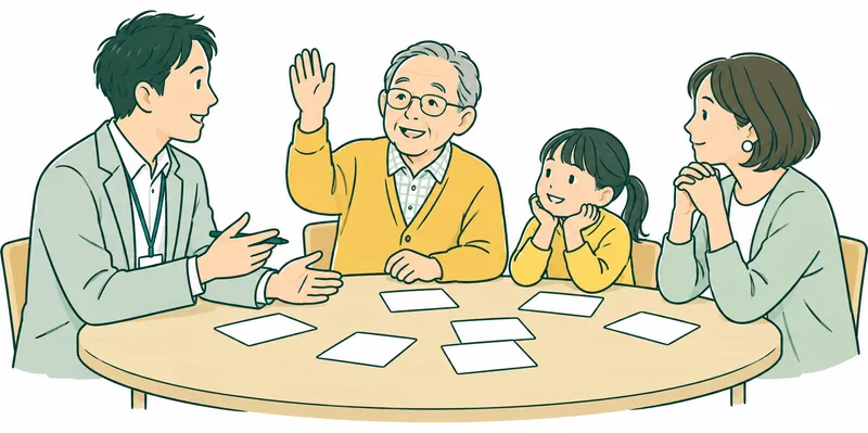 A Japanese adult facilitator at a round table with three residents including an older adult and a child, considering blank idea cards and listening respectfully, one resident raising a hand.